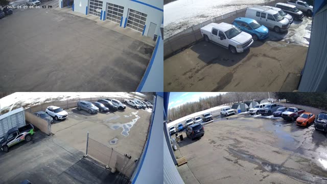 2x2 camera grid showing a commercial parking lot on a display station